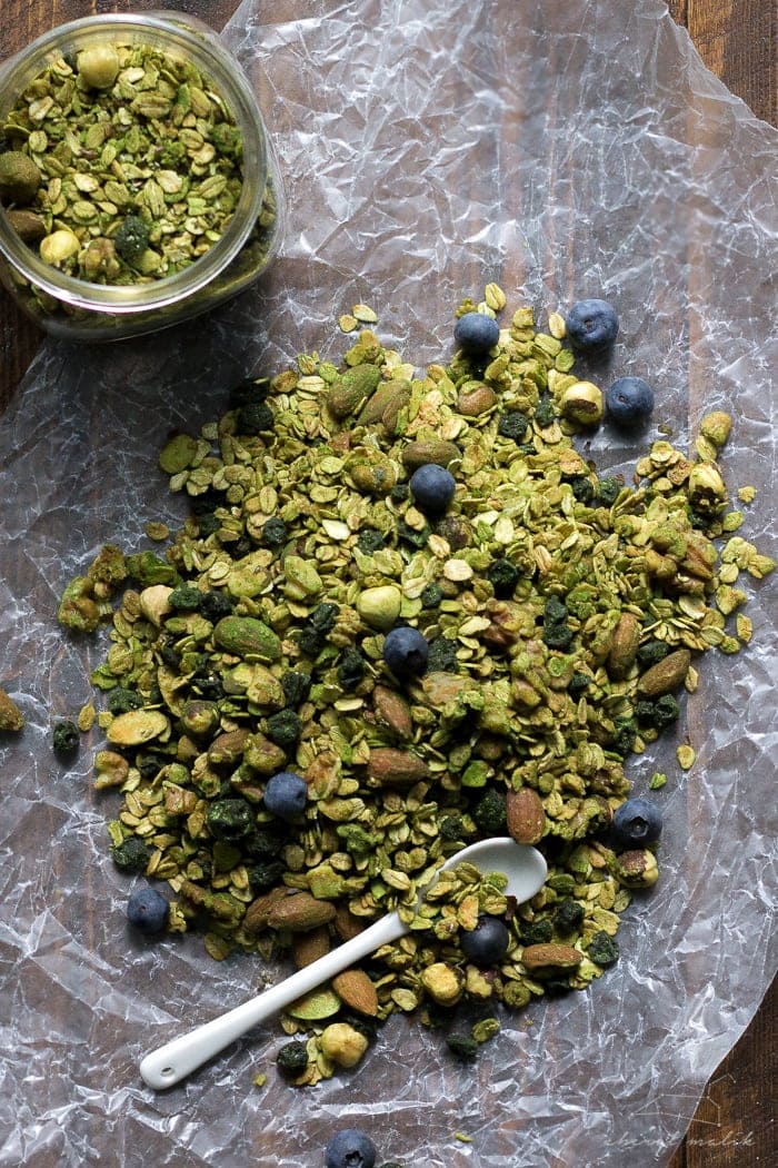 Matcha granola with dried blueberries. All of the goodness of matcha powder tossed with a delish granola. Perfect snack or breakfast--tons of antioxidants! Vegan