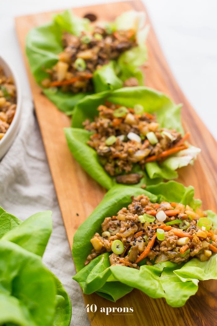 Healthy PF Changs lettuce wraps recipe on a board