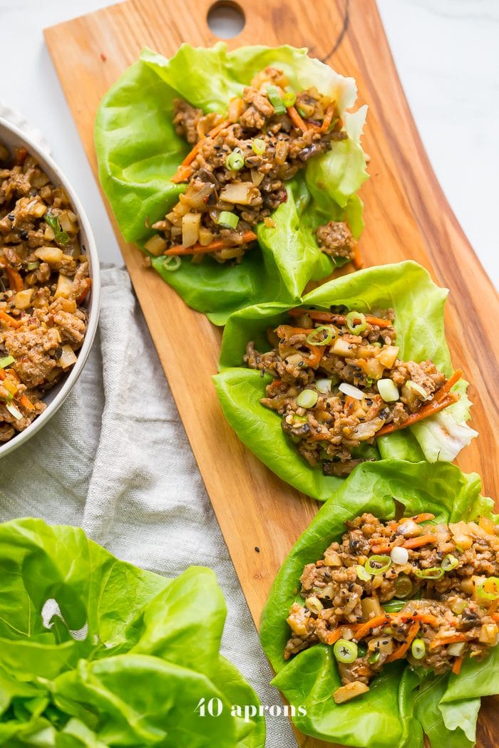 Healthy PF Changs lettuce wraps recipe on a board 