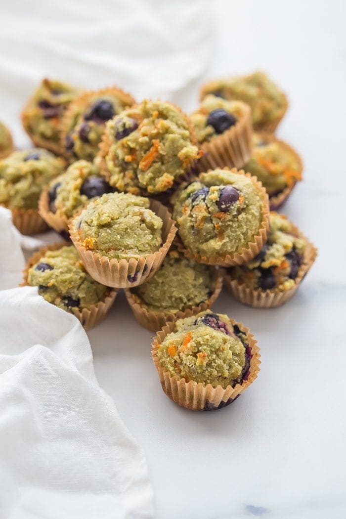 These gluten-free muffins for kids (with blueberries and avocado) are the perfect back-to-school muffins! Gluten and grain free, made with cultured dairy, and with low sugar, they're great to serve to a class, too. These gluten-free muffins for kids are packed with fruits and veggies, including carrots, avocado, and blueberries! I think your family will love these gluten-free muffins for kids just as much as mine does.