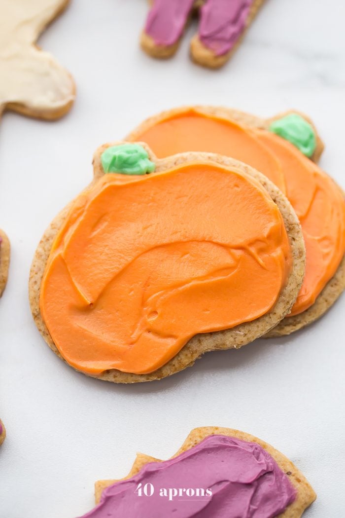 These paleo Halloween cookies are almost too cute to handle. Tender and soft with a paleo buttercream-style frosting, these paleo Halloween cookies are a must for this holiday! Whether you cut them into pumpkins, ghosts, or bats (or maybe zombies, anyone?), these paleo Halloween cookies are a healthier way to enjoy the classic holiday treat. No tricks here!