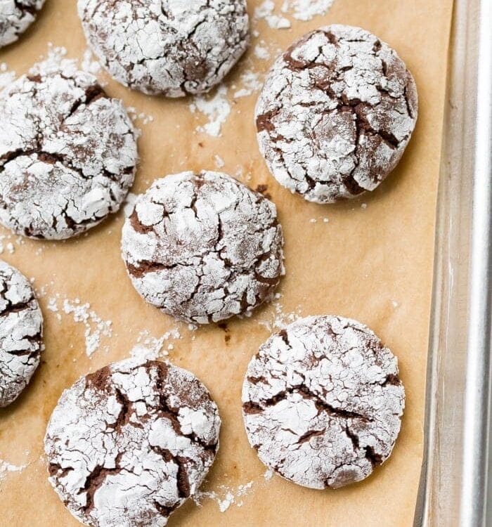 These peppermint paleo gluten-free crinkle cookies are fudgy and rich, perfect for the holidays. Grain-free and refined-sugar-free, these paleo gluten-free crinkle cookies are a guilt-free way to indulge in holiday treats without breaking your commitment to a healthier lifestyle. These paleo gluten-free crinkle cookies have hints of peppermint, making them positively festive. Your friends and family will never believe these gluten-free crinkle cookies are paleo!