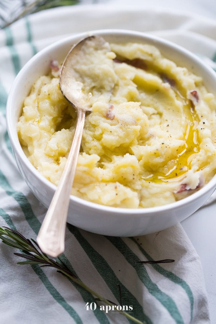 These Whole30 Instant Pot mashed potatoes with garlic and herbs are a Whole30 Thanksgiving dream: rich, creamy, garlicky, and so easy. These Whole30 Instant Pot mashed potatoes are a must for any paleo Thanksgiving table or Whole30 Thanksgiving table, and they'll become your favorite paleo Instant Pot mashed potatoes recipe for sure!