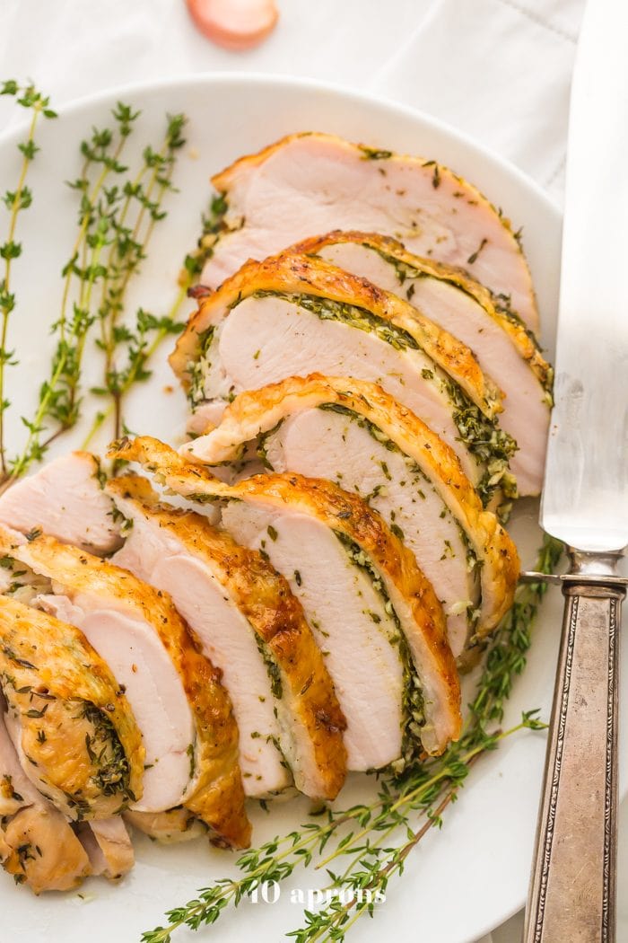 This Whole30 turkey breast and gravy is epic: brined to perfection with an herb butter stuffed under the skin (using ghee, of course)! It's my perfect Thanksgiving turkey made Whole30 Thanksgiving compliant, and it's a must for any paleo Thanksgiving or Whole30 Thanksgiving! This Whole30 turkey breast and gravy might actually become your favorite turkey recipe...
