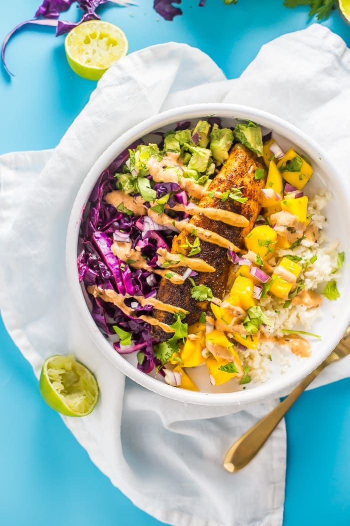 Fish taco bowl with mango salsa in a white bowl