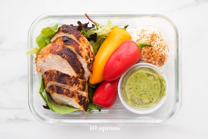 Container of healthy Mexican chicken meal prep stacked on each other