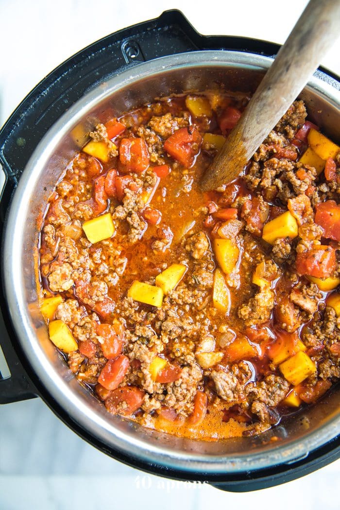 Instant Pot full of Whole30 chili with butternut squash, beef, pork, and tomatoes
