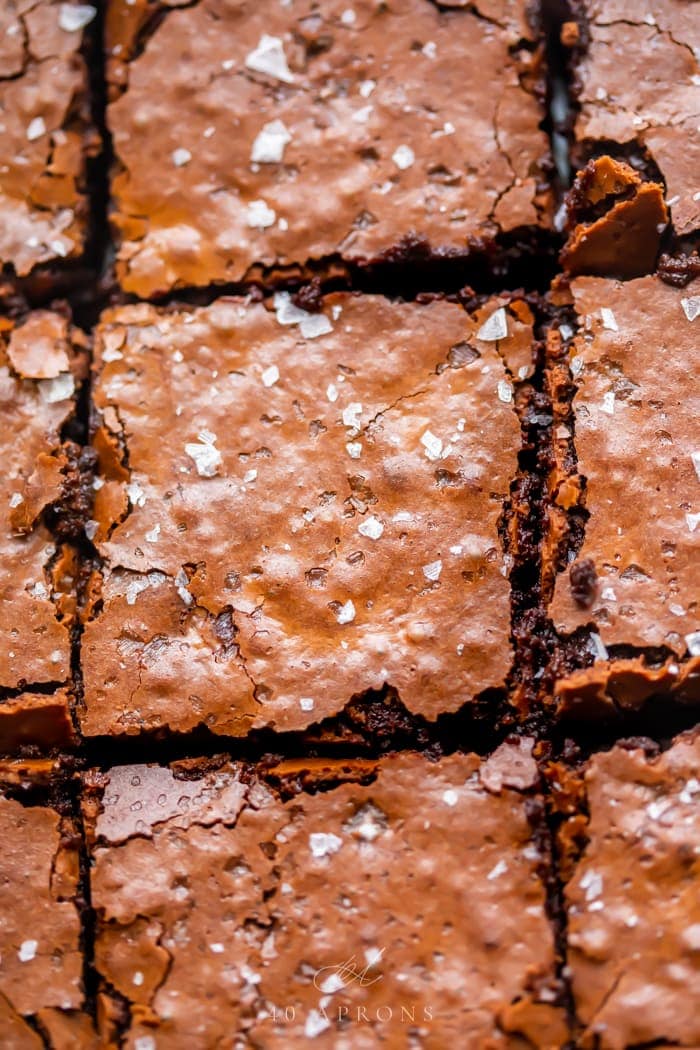 An up-close shot of the crunchy top on these perfect gluten free brownies, topped with flake sea salt