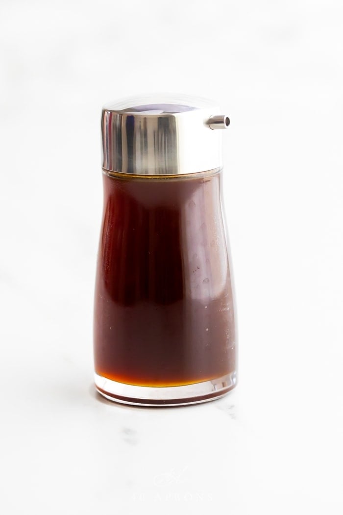 A bottle of healthy soy sauce substitute with a silver pour top