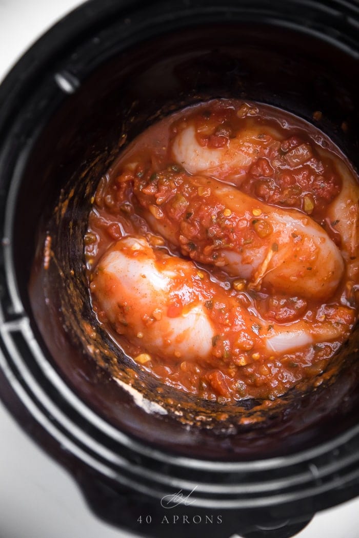 Chicken breasts with salsa and Mexican seasoning in the slow cooker