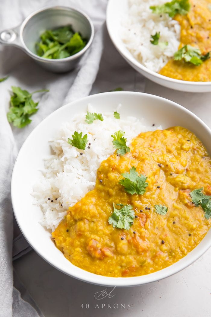 Indian Dal garnished with fresh herbs and served with rice