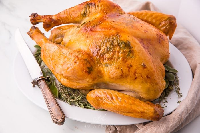A roasted turkey served on a large platter