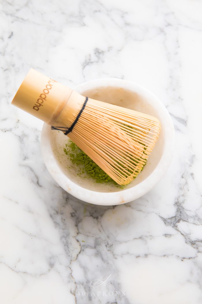 Bamboo whisk in bowl of matcha