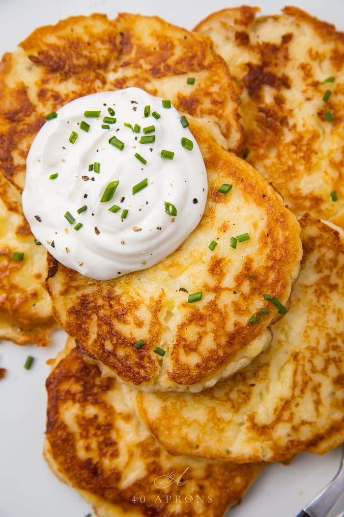 Sour cream on top of the savory pancakes