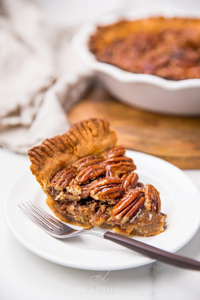Pecan pie served on a plate with a fork