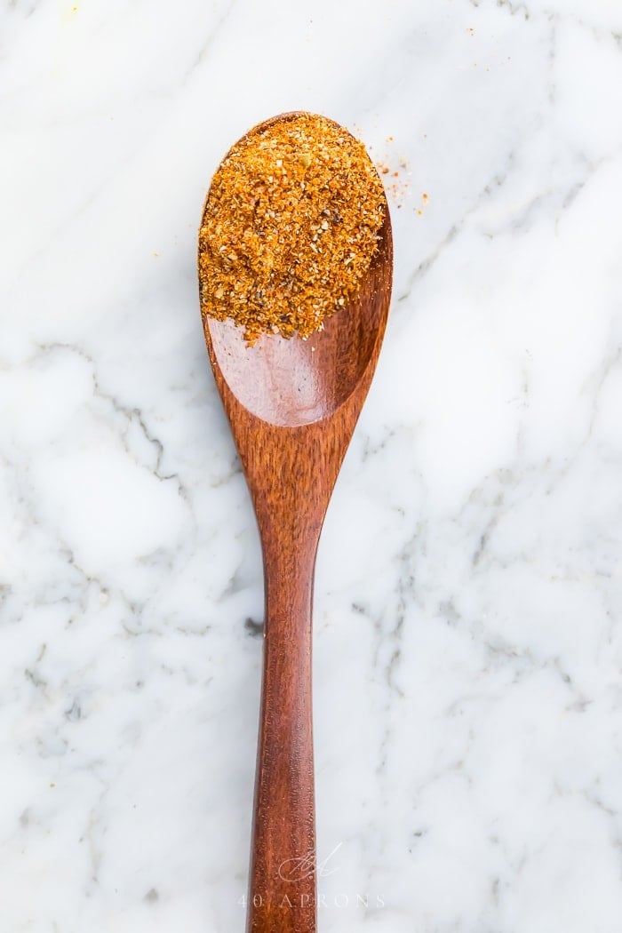 Spice mix on a wooden spoon