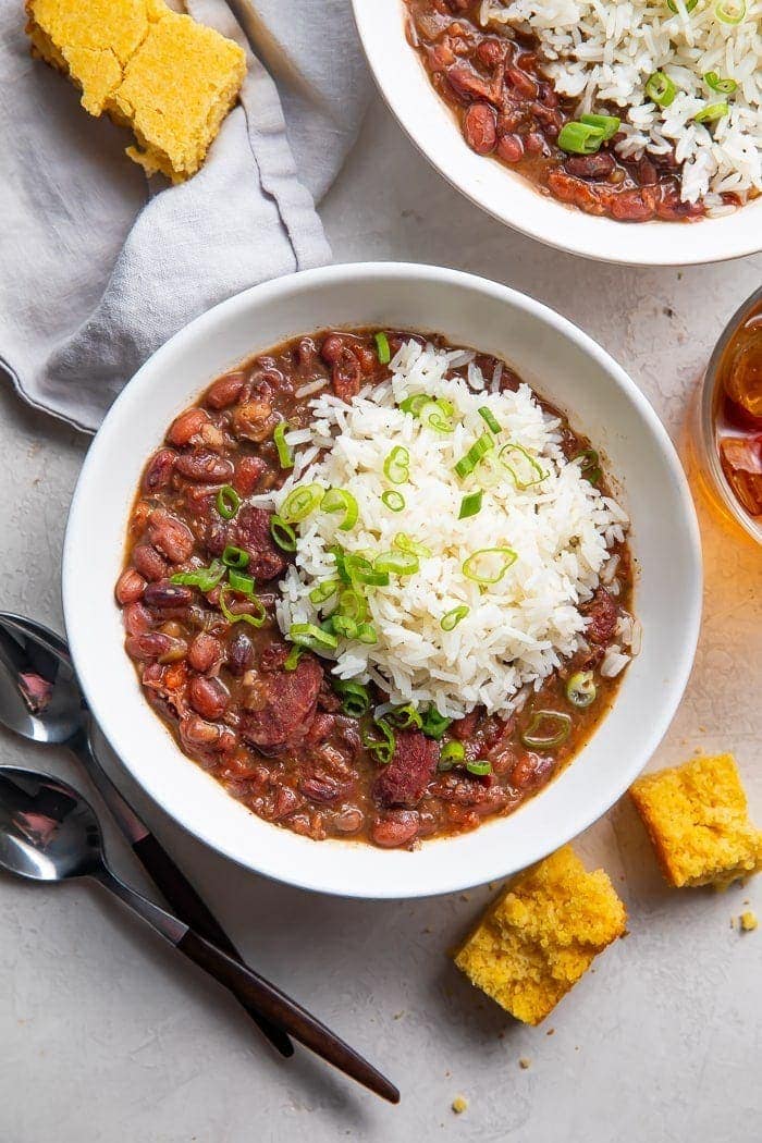 Instant Pot red beans and rice in a bowl with a side of cornbread