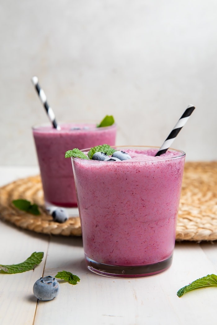 Two glasses of blueberry smoothies