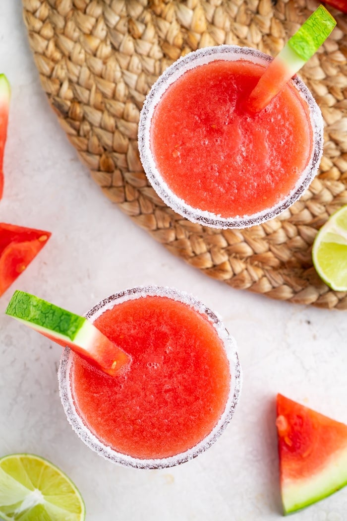 Overhead of two glasses of watermelon margaritas