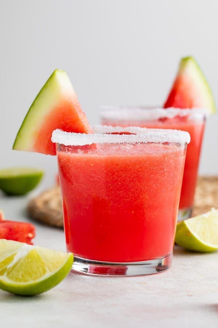 Watermelon margarita in a glass with a slice of watermelon