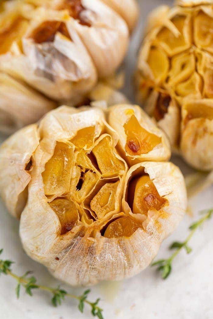 Close-up of roasted garlic on a sheet of aluminum foil