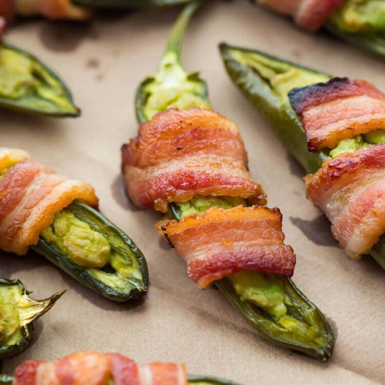 Close view of jalapeno poppers wrapped in bacon.