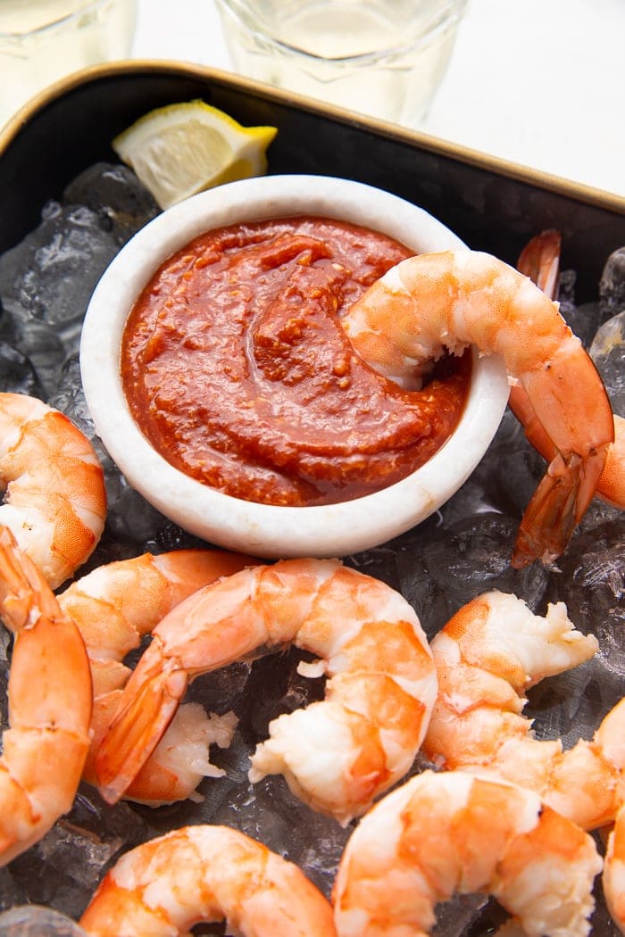 Shrimp dipped in shrimp cocktail sauce
