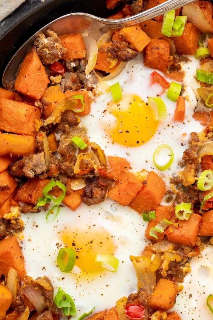 Close-up overhead shot of sweet potato hash in a skillet