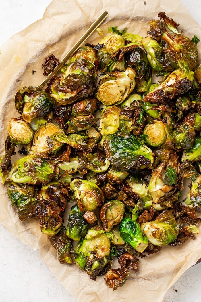 Air fryer brussels sprouts on a parchment lined plate