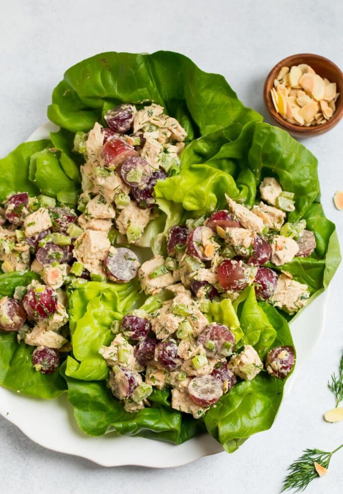 Whole30 chicken salad in lettuce cups on a white plate