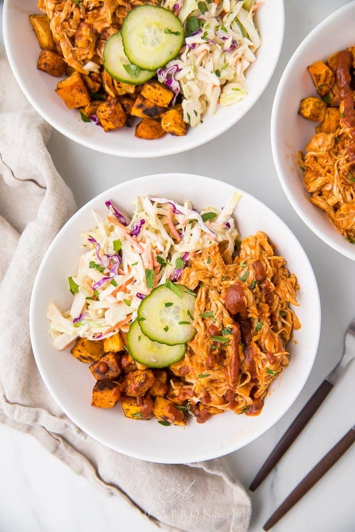 Paleo bbq chicken bowls with coleslaw and sweet potatoes