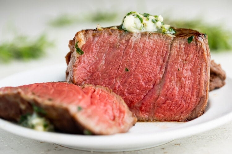Medium rare sous vide filet mignon topped with herb butter