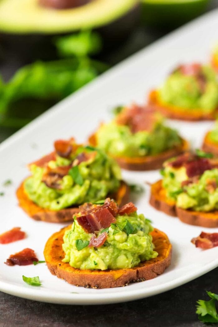 Sweet potato medallions topped with avocado and bacon