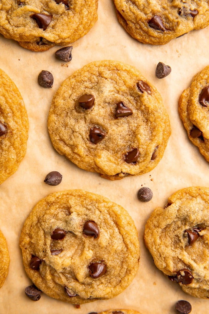 7 vegan chocolate chip cookies on parchment paper