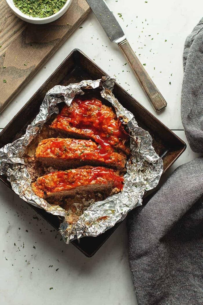 3 slices of meatloaf on aluminum foil