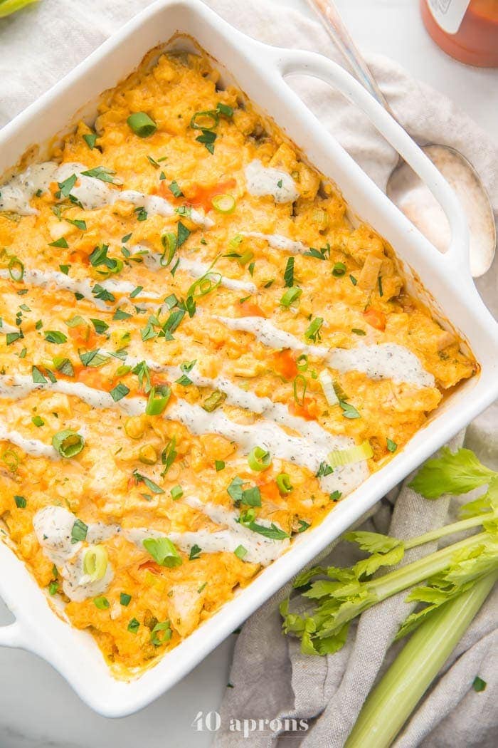 Paleo buffalo chicken casserole in a square pan turned at an angle