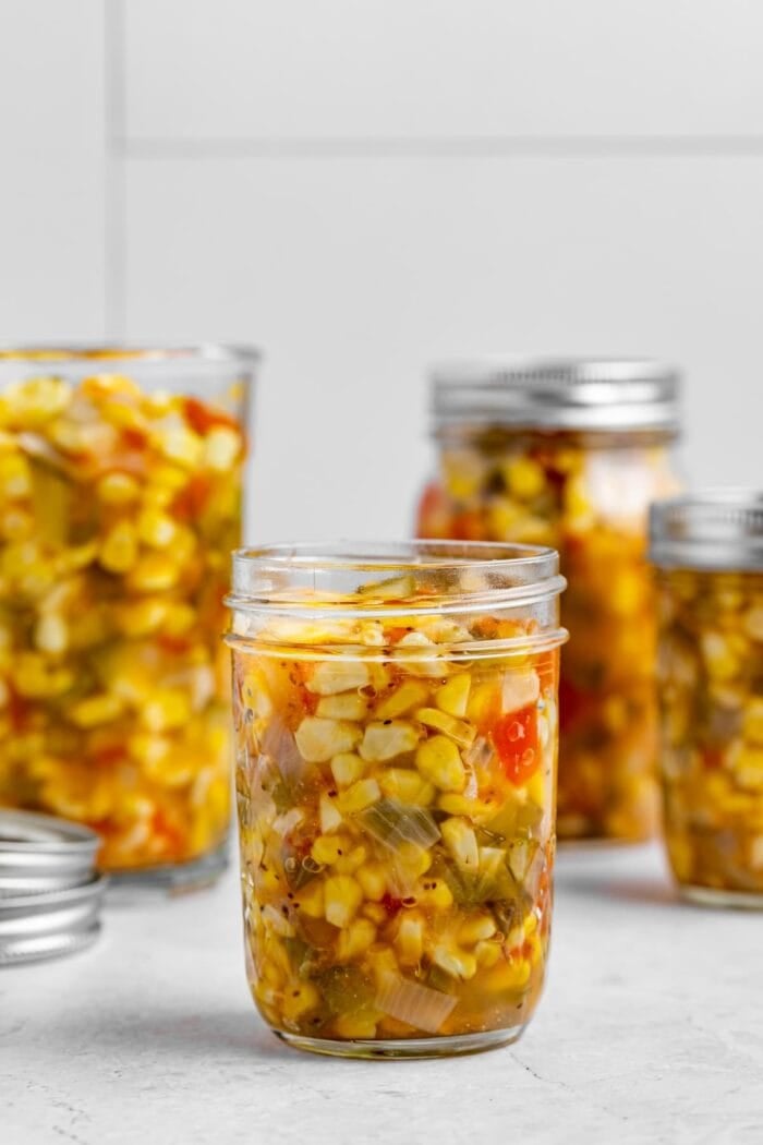 corn relish in four canning jars