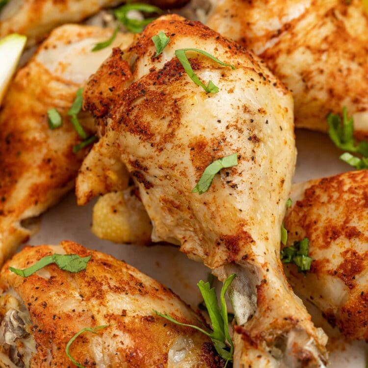 close up image of instant pot chicken legs with fresh parsley on top