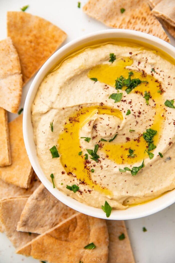 Close up photo of baba ganoush in a white bowl