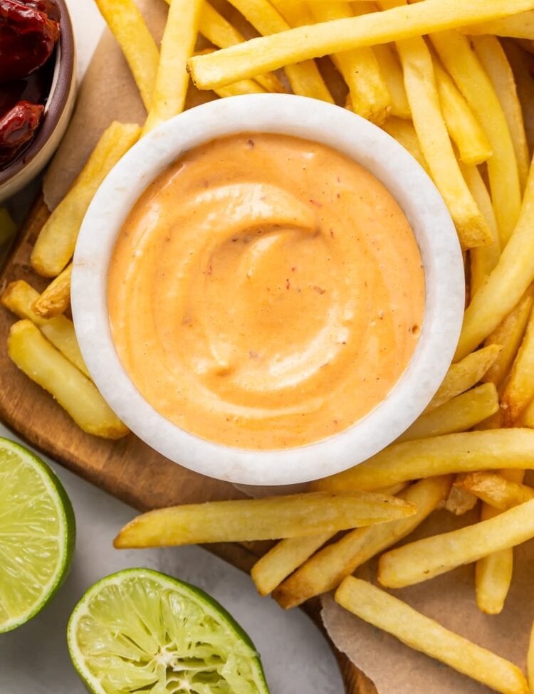 French fries surrounding a small bowl of chipotle mayo