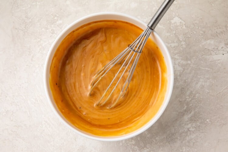 Copycat Chick-Fil-A sauce in a bowl with a whisk