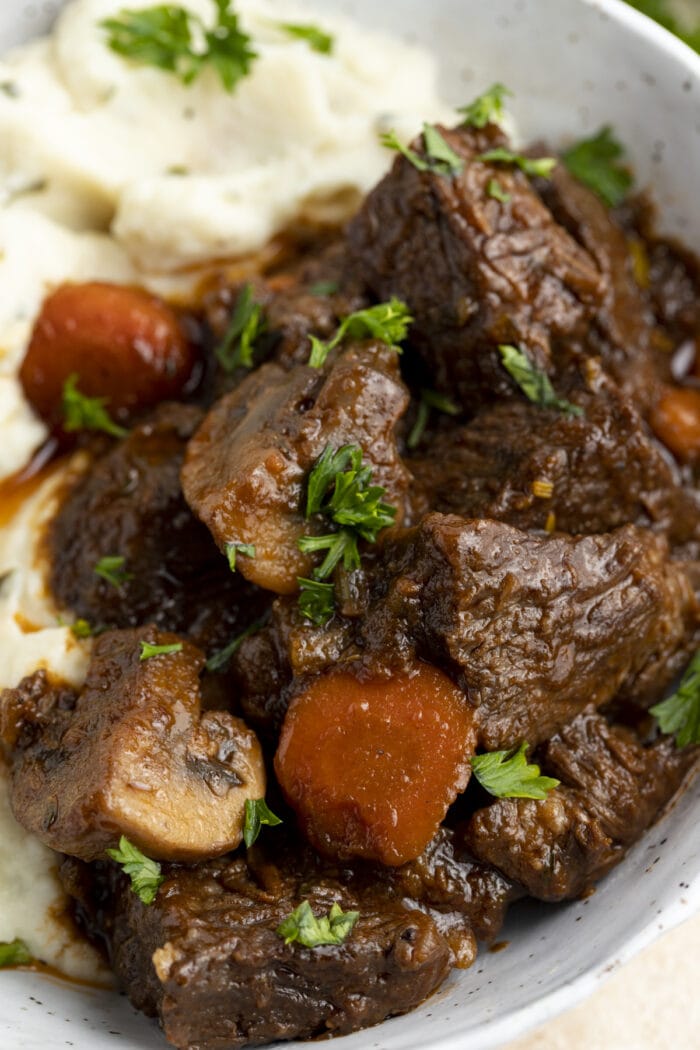 Close-up of keto beef stew and mashed cauliflower in a large bowl