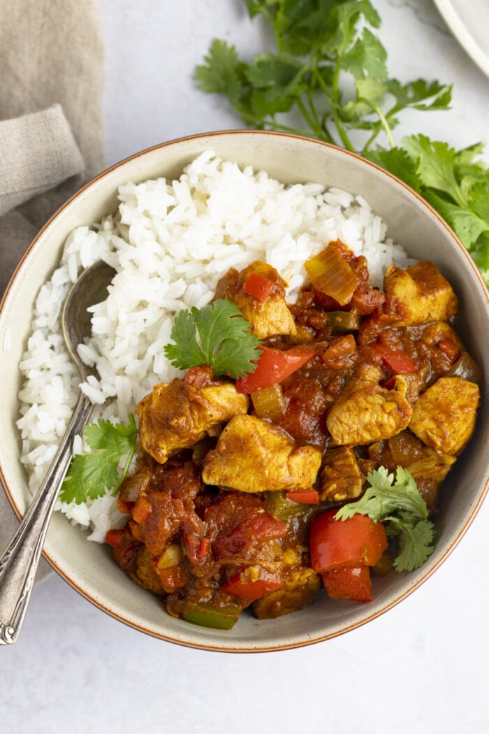 Overhead view of chicken jalfrezi in a bowl with white rice