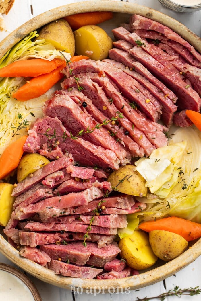 Overhead view of corned beef, cabbage, potatoes, and carrots in a large bowl