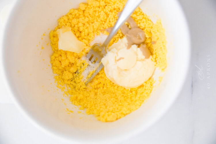 Egg yolk filling ingredients in large mixing bowl before being combined.
