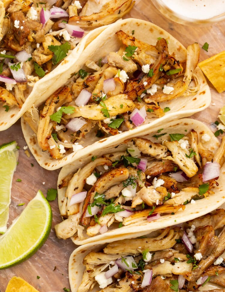Zoomed out photo of a chicken carnitas taco with Instant Pot chicken carnitas.